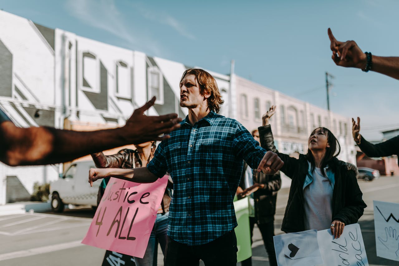 Vibrant street protest scene with diverse group holding justice signs. Encourages change.